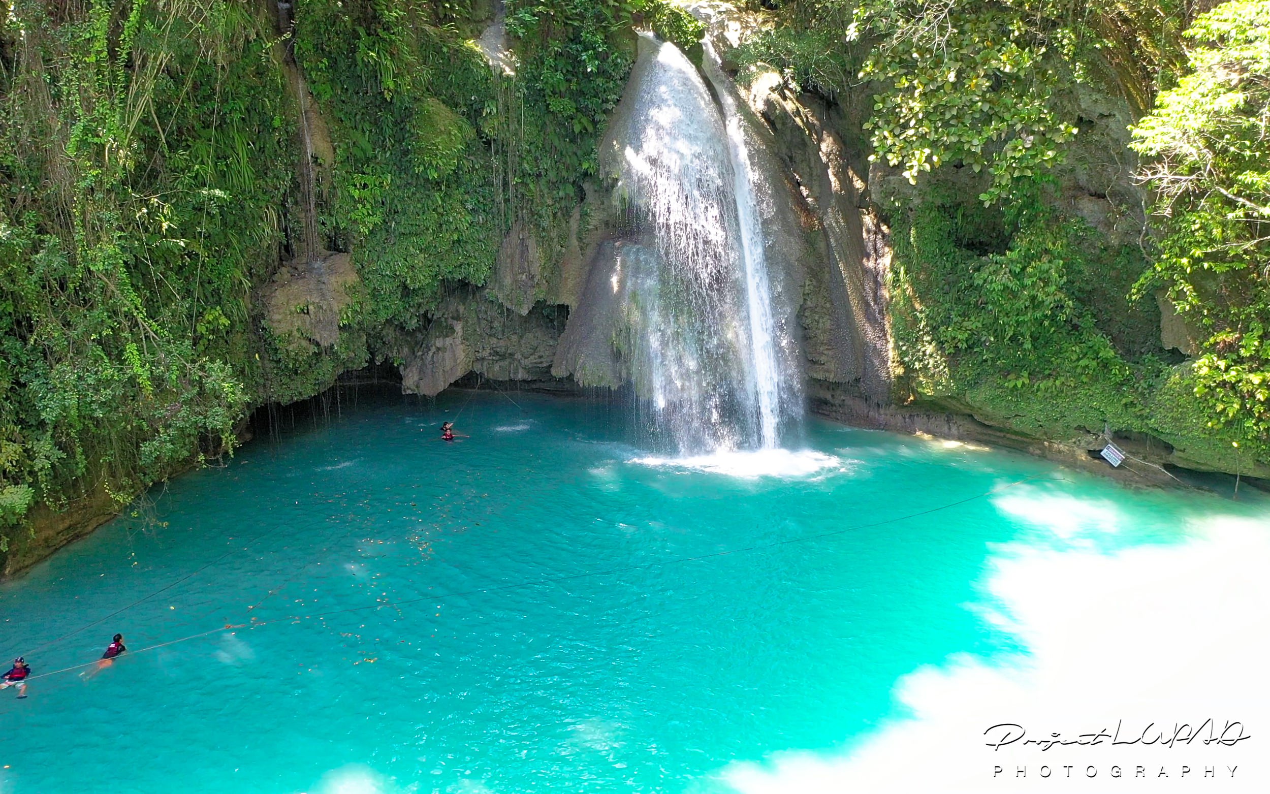 Mesmerizing Blue Water Kawasan Falls in Cebu Aerial View