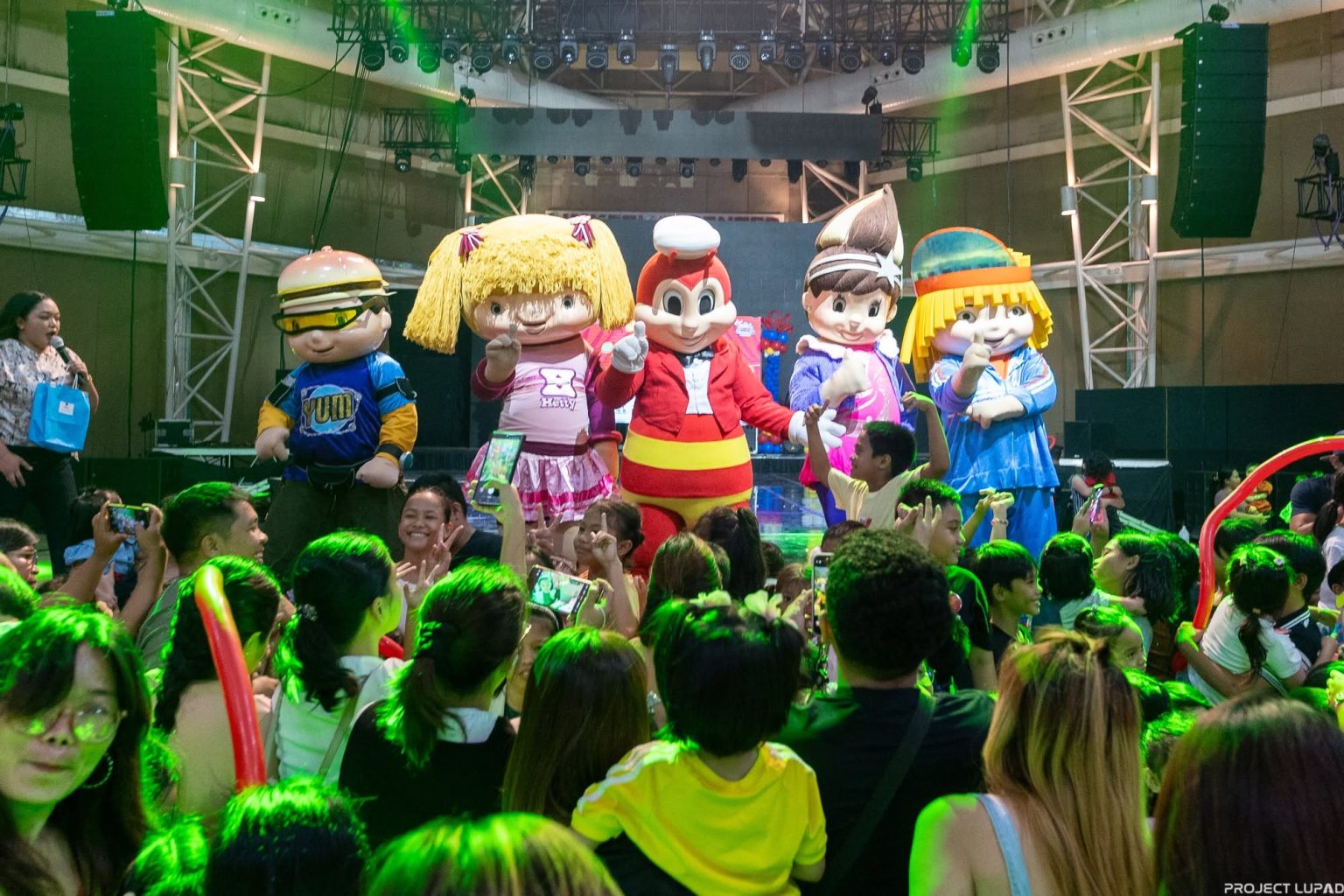 Jollibee and friends on stage at the Jollibee Kids Convention, featured in our Jollibee case study